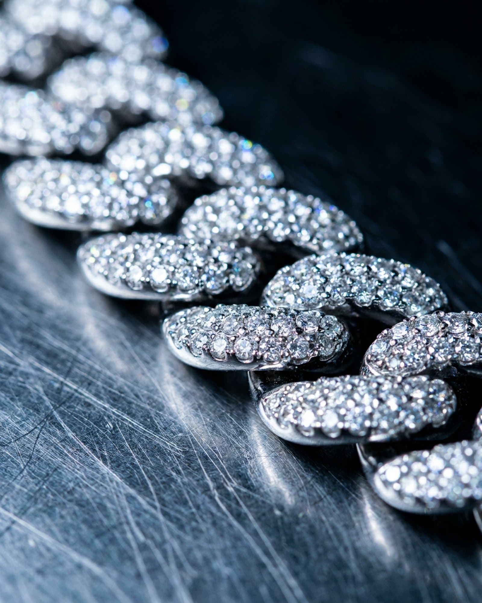 Close on the pave-set links of the iced cuban link chain