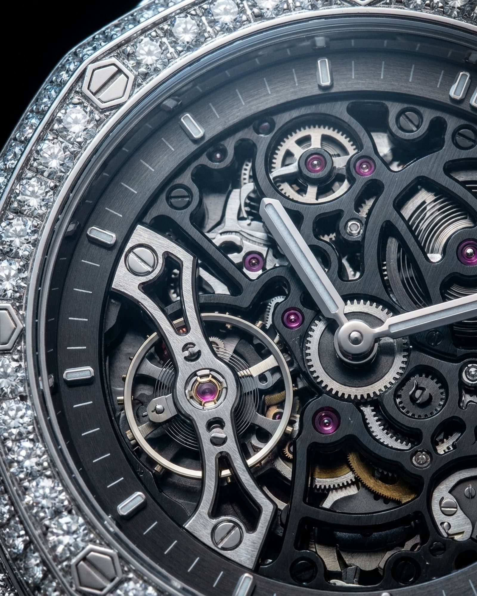 Close-up of the black-bridge skeleton dial inside the set bezel