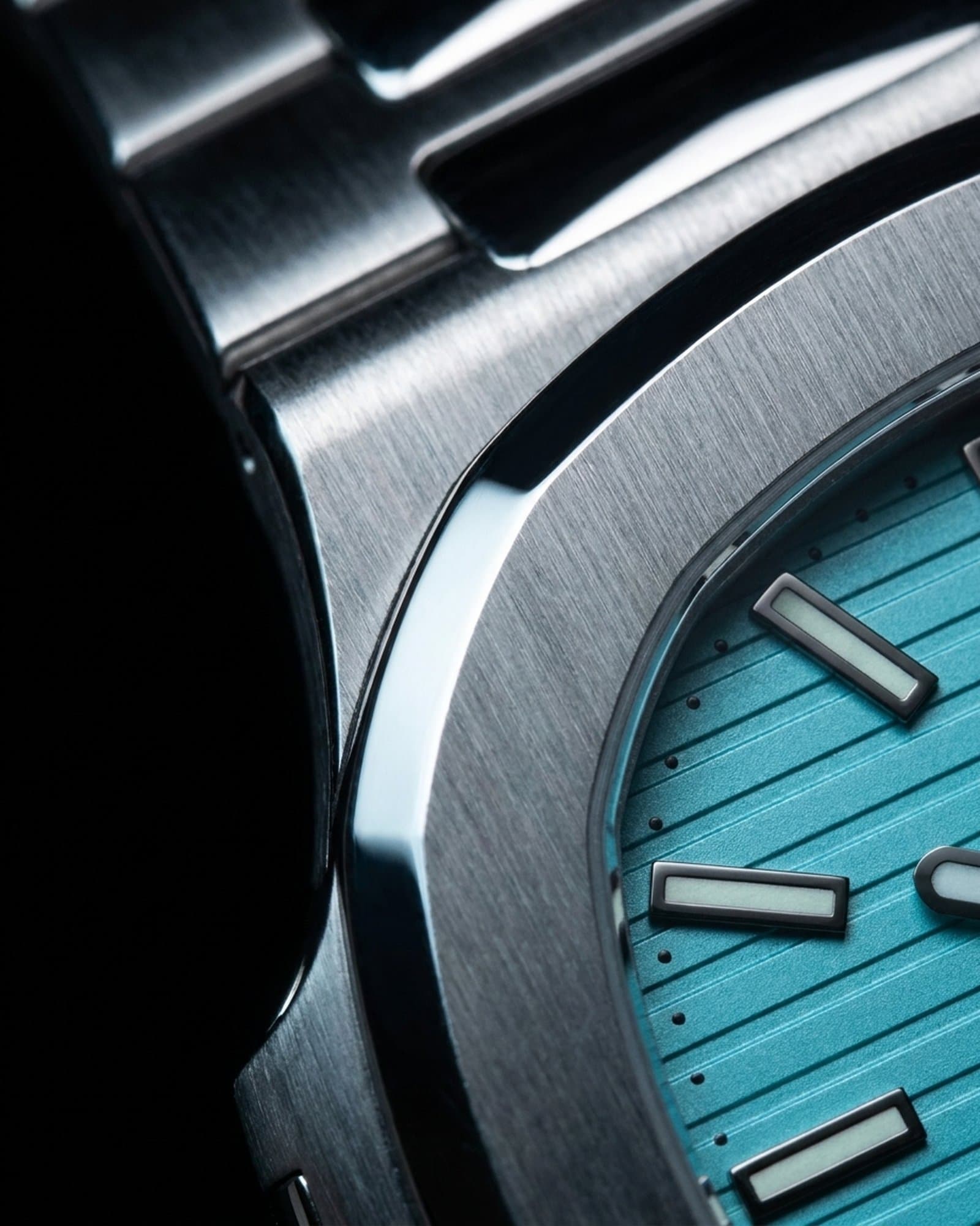 Close-up of the brushed bevel beside the turquoise embossed dial